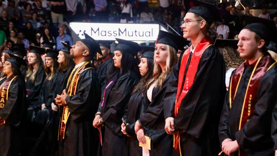 grads in cap and gown at 2025 commencement ceremony