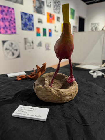 Bird standing on a nest made out of clay, 3D sculpture by STCC student Morgan Wright