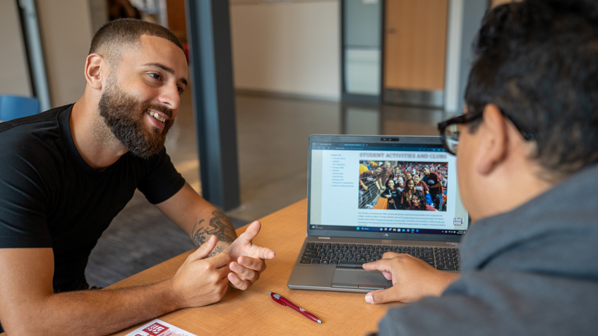 student consuting academic advisor