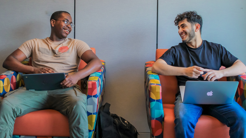 MILE students studying on laptops