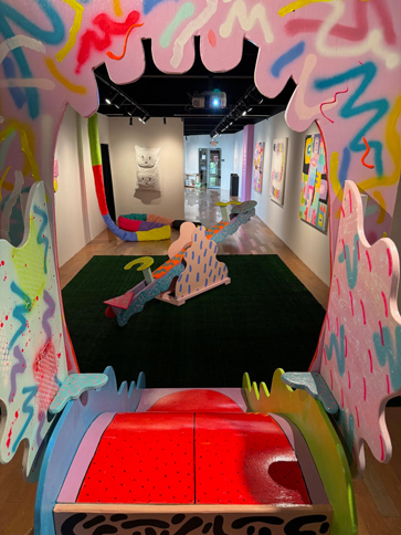 from on top of a slide the slide appears as a red tongue and slide entrace as a wide open mouth