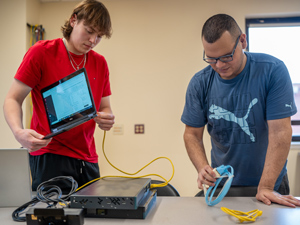 cybersecurity students setting up network