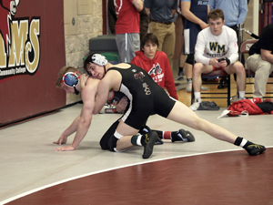 men's wrestler making a pin