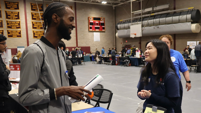 student talking to employer at career fair