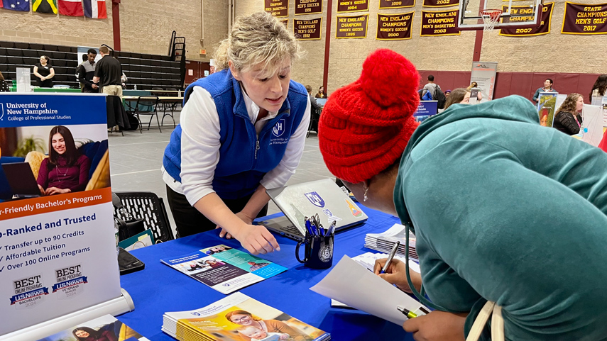 student signing sheet for recruiter at job fair