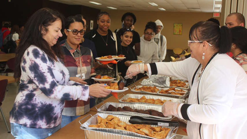 attendees getting food at Hispanic Heritage Month Celebration & Latin Food Tasting