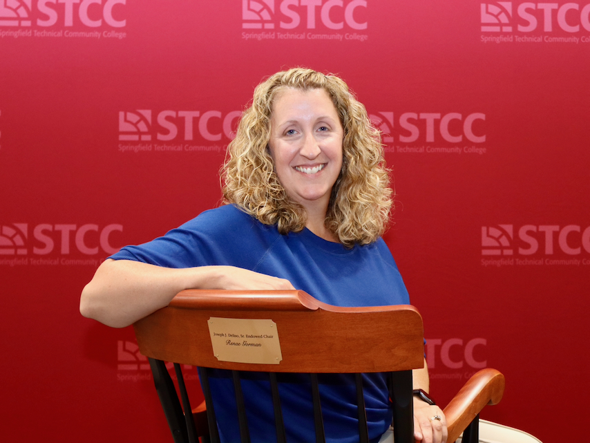 Professor Renae Gorman with ceremonial chair for Endowed Chair award