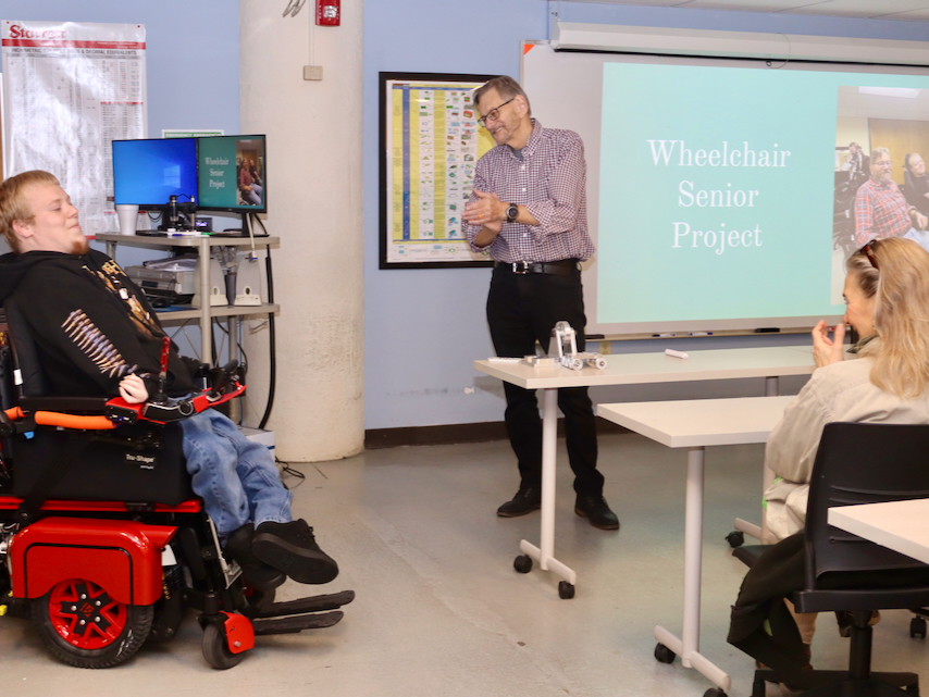 Gabriel Sommers and Joseph Sommers in a classroom