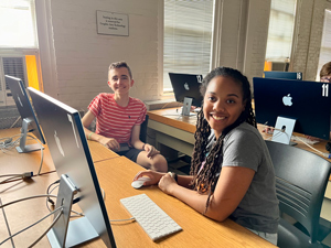 two kids at computers
